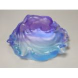 A blue and lilac glass dish with a kneeling nude, apocryphal Daum mark 18cm long