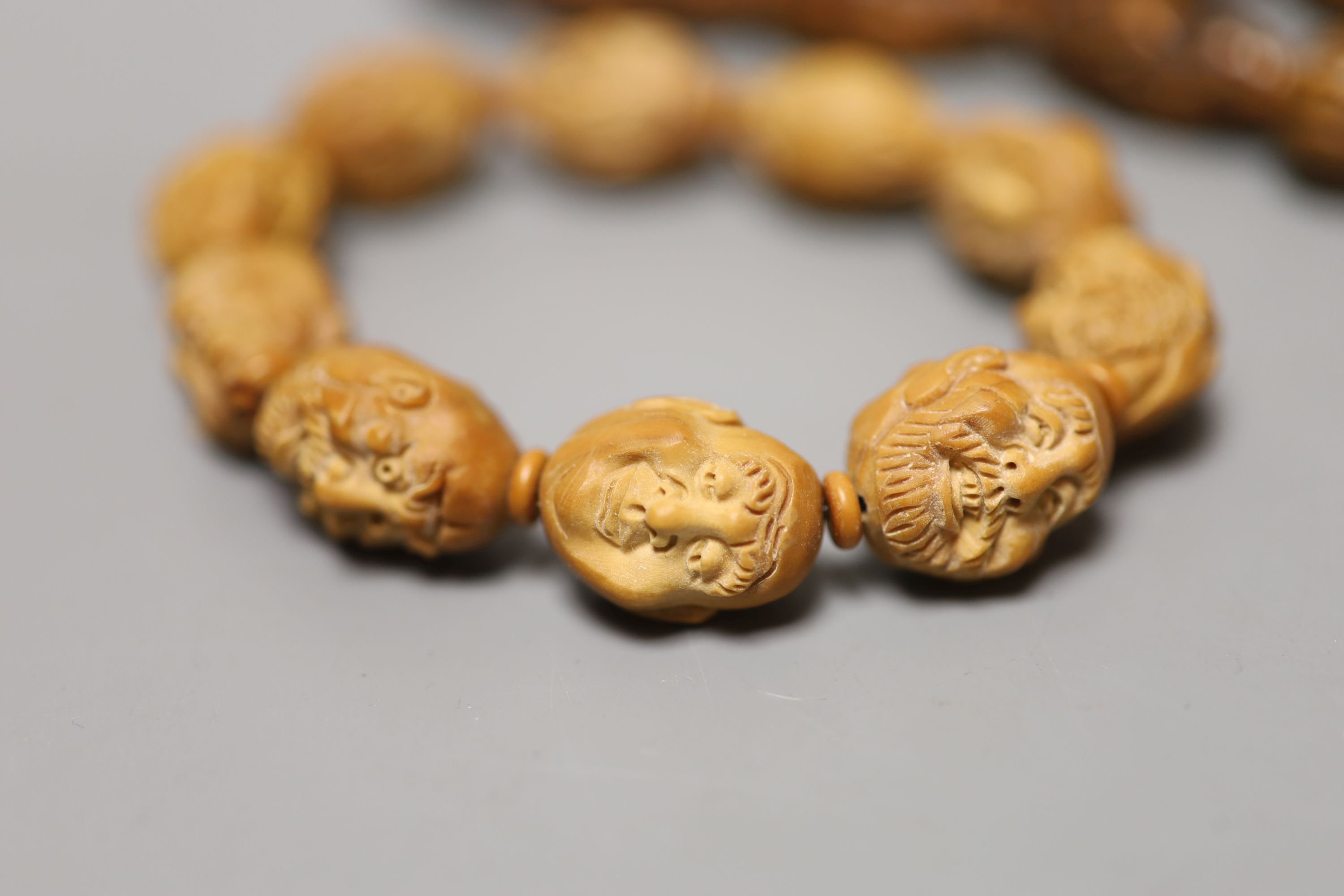 A coquilla nut necklace, bracelet and two small ornamental carvings - Image 2 of 3