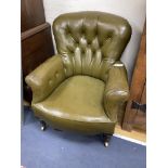 A Victorian buttoned library chair upholstered in olive green leatherette, width 70cm, depth 70cm,