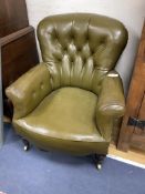 A Victorian buttoned library chair upholstered in olive green leatherette, width 70cm, depth 70cm,