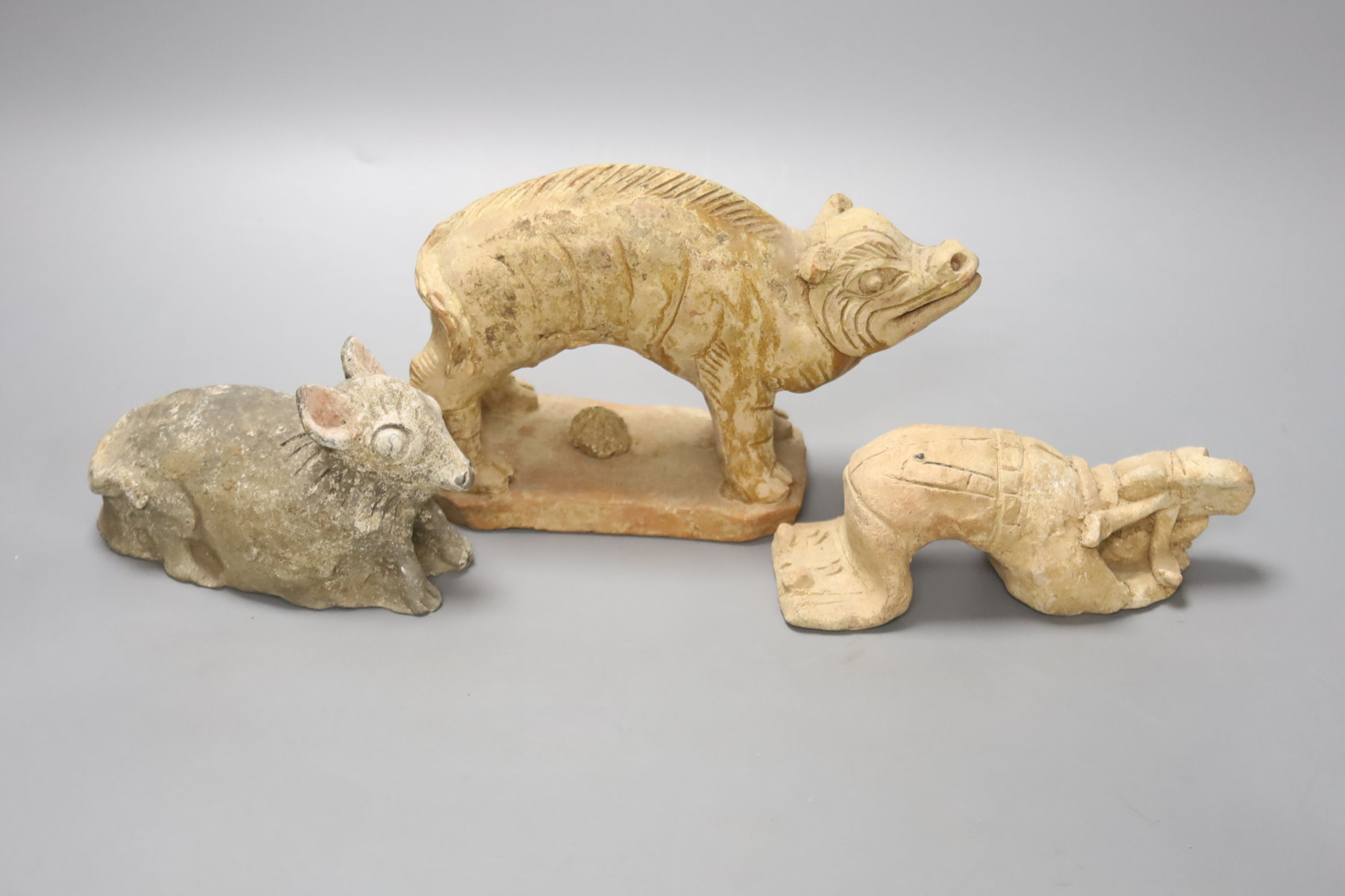 A Chinese Han terracotta model of a standing pig, 17cm long 12cm high, together with two further - Image 4 of 4