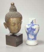 A Thai or Burmese bronze Buddha’s head, with stand 20.5cm and a 19th century Chinese blue and