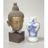 A Thai or Burmese bronze Buddha’s head, with stand 20.5cm and a 19th century Chinese blue and