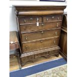 An 18th century oak chest on stand, width 105cm, depth 56cm, height 134cm