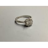 A white metal (stamped platinum) and solitaire diamond ring, size N, gross weight 4.5 g,The stone