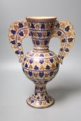 A Persian copper lustre two handled vase