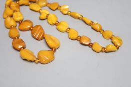 A single strand graduated amber pebble necklace, with amber bead spacers, 82cm, gross 84 grams.