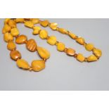 A single strand graduated amber pebble necklace, with amber bead spacers, 82cm, gross 84 grams.