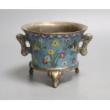 A heavy Chinese silvered bronze twin handled censer with floral decoration, a four character