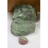 Three fragments of Anyolite (or ruby in zoisite) originating from a ruby mine in Kenya, largest 32 x