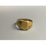 An Edwardian 18ct signet ring with engraved initial and inscription, size S/T,6.7 grams.