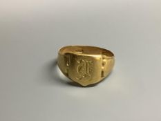 An Edwardian 18ct signet ring with engraved initial and inscription, size S/T,6.7 grams.