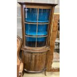 An Edwardian mahogany bowfront narrow display cabinet, width 60cm, depth 36cm, height 164cm