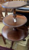 A Georgian mahogany revolving three tier dumb waiter, height 100cm