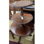 A Georgian mahogany revolving three tier dumb waiter, height 100cm