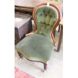 A Victorian mahogany spoon back nursing chair