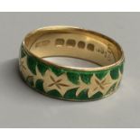 A modern 18ct gold and green enamel band, size P, gross 5.6 grams (enamel a.f.)