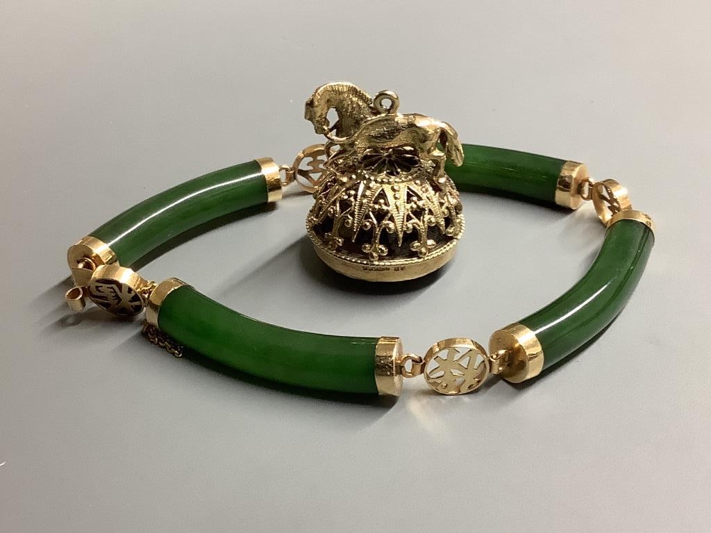 A modern 14 K yellow metal and nephrite set bracelet and a modern 9 carat gold and quartz set fob