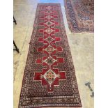 A North West Persian red ground runner, 380 x 94cm