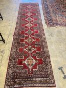 A North West Persian red ground runner, 380 x 94cm