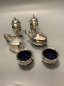 A pair of George V silver pepperettes, a pair of silver salts, and two silver mustard pots.
