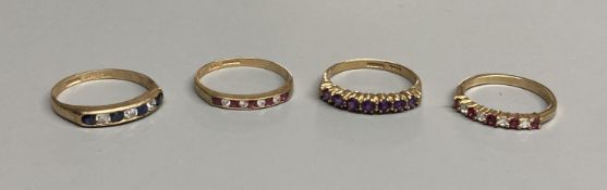 A modern 9ct gold, ruby and diamond set half hoop ring and a similar amethyst ring and two other 9ct