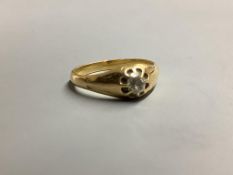 A yellow metal and claw set solitaire diamond ring, size P/Q gross 4.8 g.