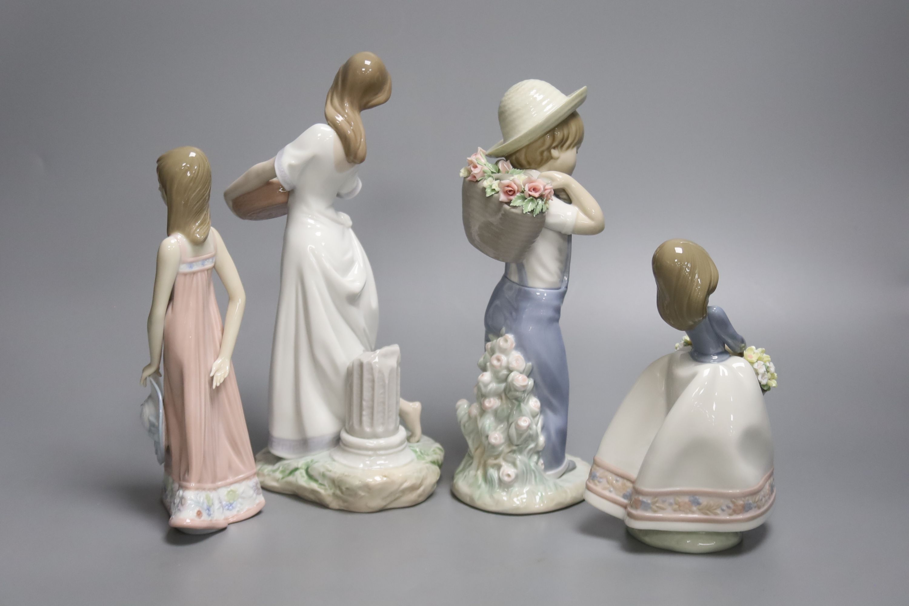 A Lladro figure of a boy "Flower Harvest" No. 1286, "May Flowers", Girl with Straw Hat, and ' - Image 2 of 3