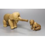 Two Danish carved wooden toys by Kay Bogesen, a standing elephant, 22cm length 14cm high and a