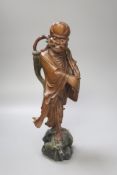 A Chinese root carving of a deity, 35cm high