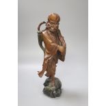 A Chinese root carving of a deity, 35cm high