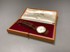 A gentleman's 9ct gold Longines Flagship automatic wristwatch, on a leather strap, with Longines
