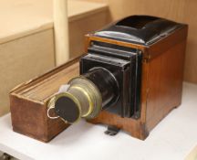 An early 20th century mahogany and brass magic lantern, together with twelve painted glass slides