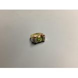 A 1950's? 750 yellow metal, peridot and diamond set dress ring, size O, gross 6.9 grams.