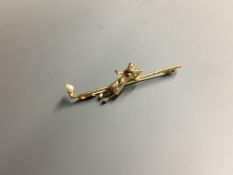 A modern 9ct gold and seed pearl set bar brooch, modelled as a golfer and golf club, 56mm, gross 4.8