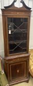 An Edwardian marquetry inlaid and cross banded mahogany standing corner cabinet, width 70cm, depth