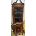 An Edwardian marquetry inlaid and cross banded mahogany standing corner cabinet, width 70cm, depth