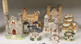 A collection of architectural Staffordshire pottery groups, tallest 22cm