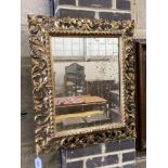 A 19th century Florentine style carved giltwood wall mirror, width 60cm, height 70cm