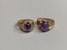 Two modern 9ct gold and cabochon amethyst set dress rings, sizes Q/R & T,gross 11.6 grams.