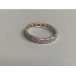 A modern white metal and diamond chip set full eternity ring, total carat weight approx. 0.35ct,