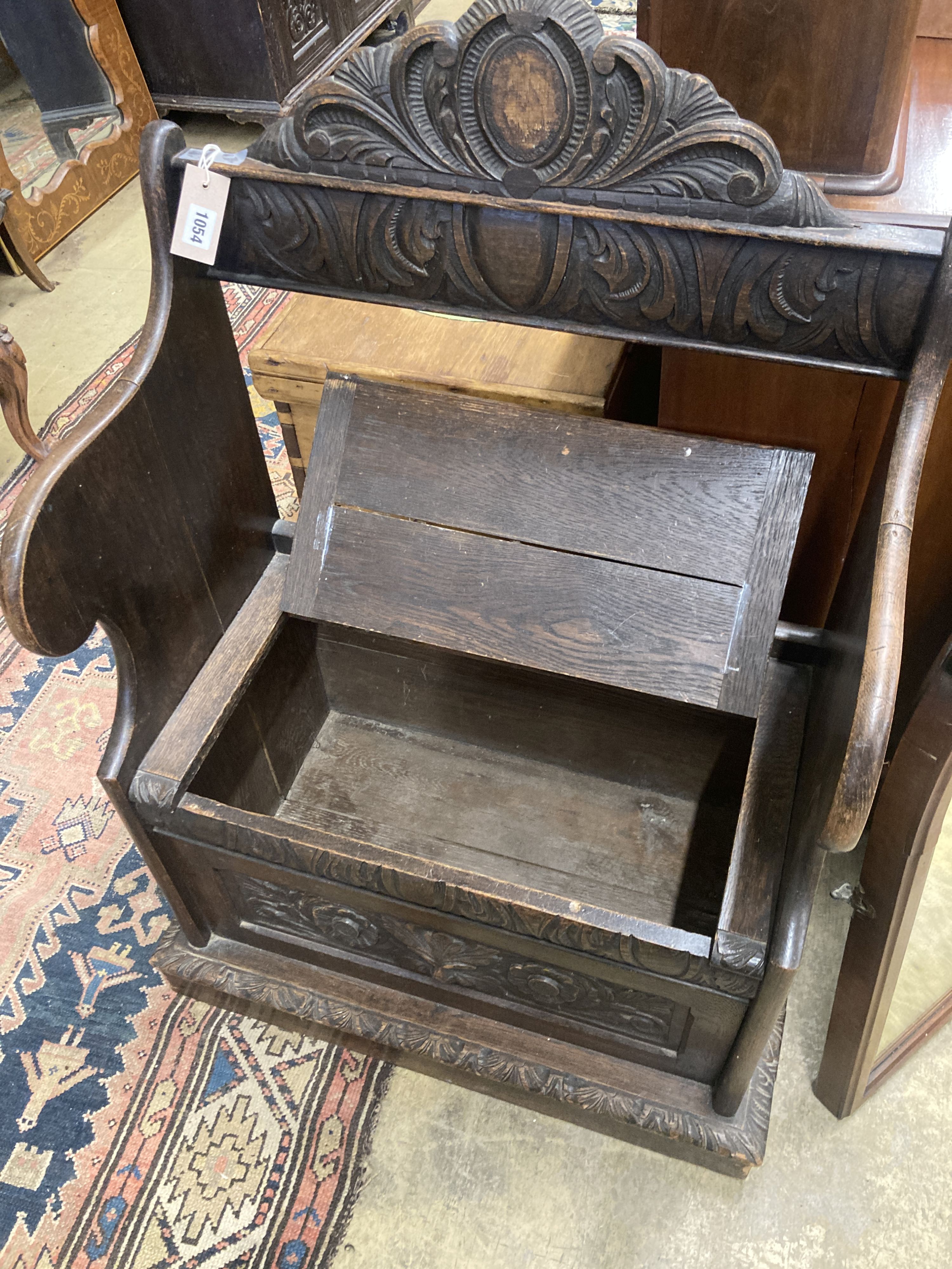 A small Flemish carved oak box seat settle, width 65cm, depth 40cm, height 104cm - Image 3 of 3