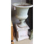 A Victorian white painted cast iron campana garden urn, diameter 56cm, height 118cm on a later