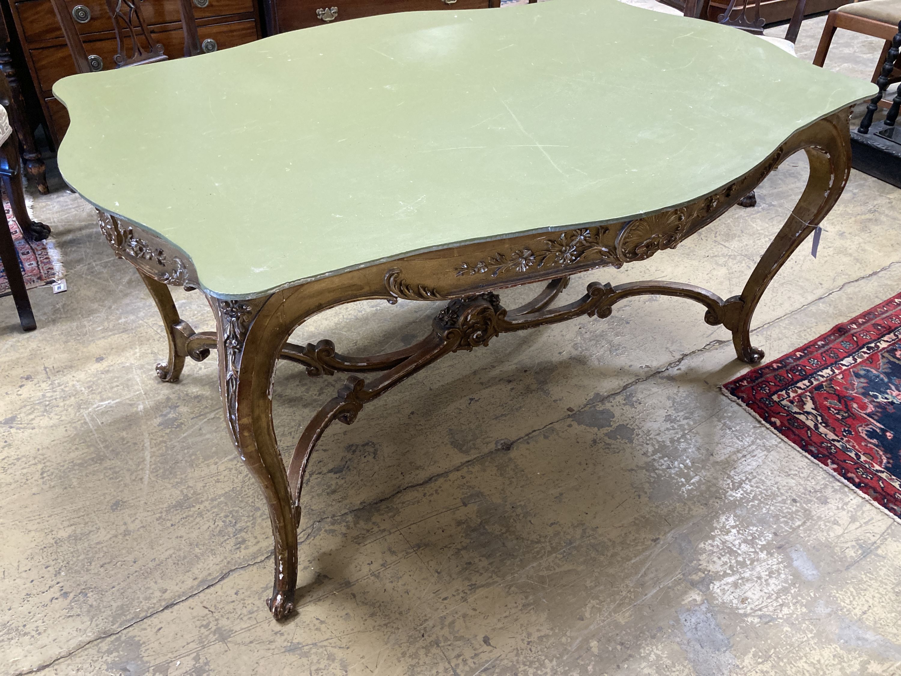 A large 19th century gilt carved wood and plaster cente table (lacking top), width 150cm, depth