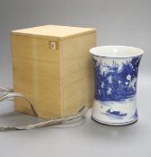A Chinese blue and white porcelain brush pot, painted with a landscape, 17cm high, in later pine