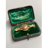 An Edwardian 9ct gold and gem set bar brooch, 47mm, gross 4.1 grams