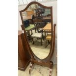 A large Edwardian inlaid mahogany shield shaped cheval mirror, width 80cm, height 177cm