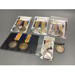 A collection of WW1 medal pairs;75661 Gnr. Albert Smith, R.A.53109 Dvr. George Russell R.A.88925