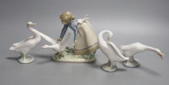 A Lladro figure of a girl with a goose and three single geese models