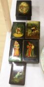 Six Russian painted lacquer boxes, each signed and inscribed, largest 18 x 13cm